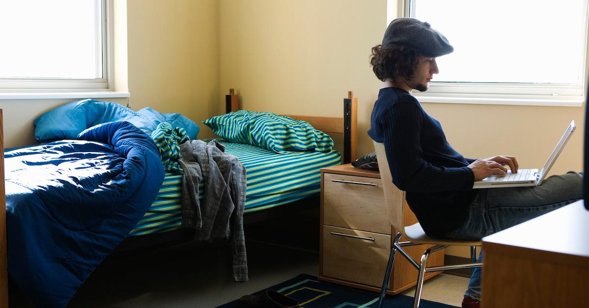 Student studying in dorm room - stock photo