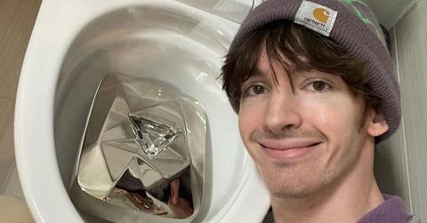 Flamingo the YouTuber with his platinum play button in the toilet.