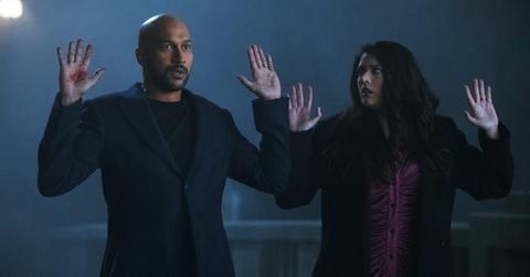 Keegan Michael-Key and Cecily Strong looking afraid while being held up in Season 2 of 'Schmigadoon!'.