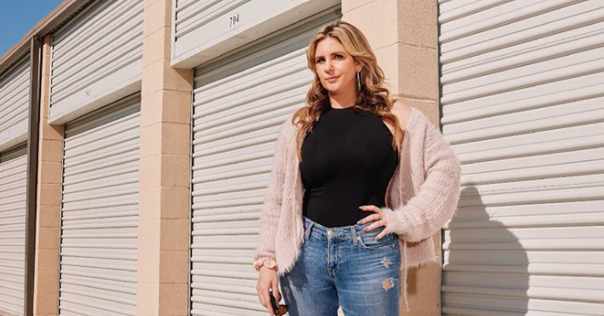 Brandi Passante posing in front of storage lockers