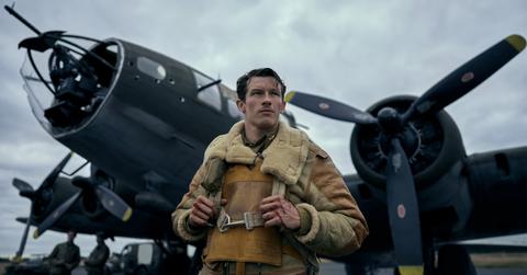 Callum Turner standing in front of a plane in 'Masters of the Air'