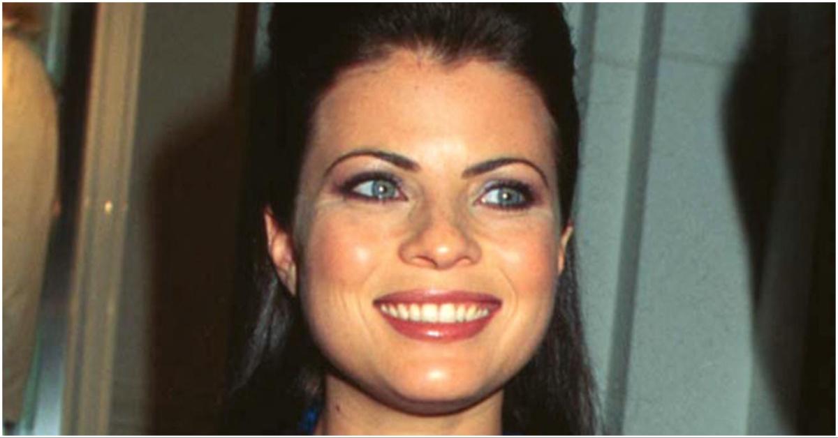 Old photo of Yasmine Bleeth smiling