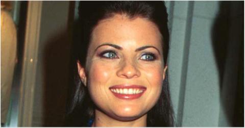 Old photo of Yasmine Bleeth smiling