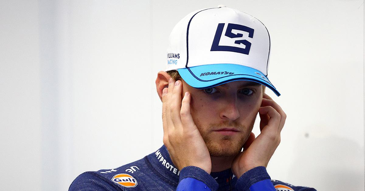 Logan Sargeant plugging his ears during an F1 race in The Netherlands. 