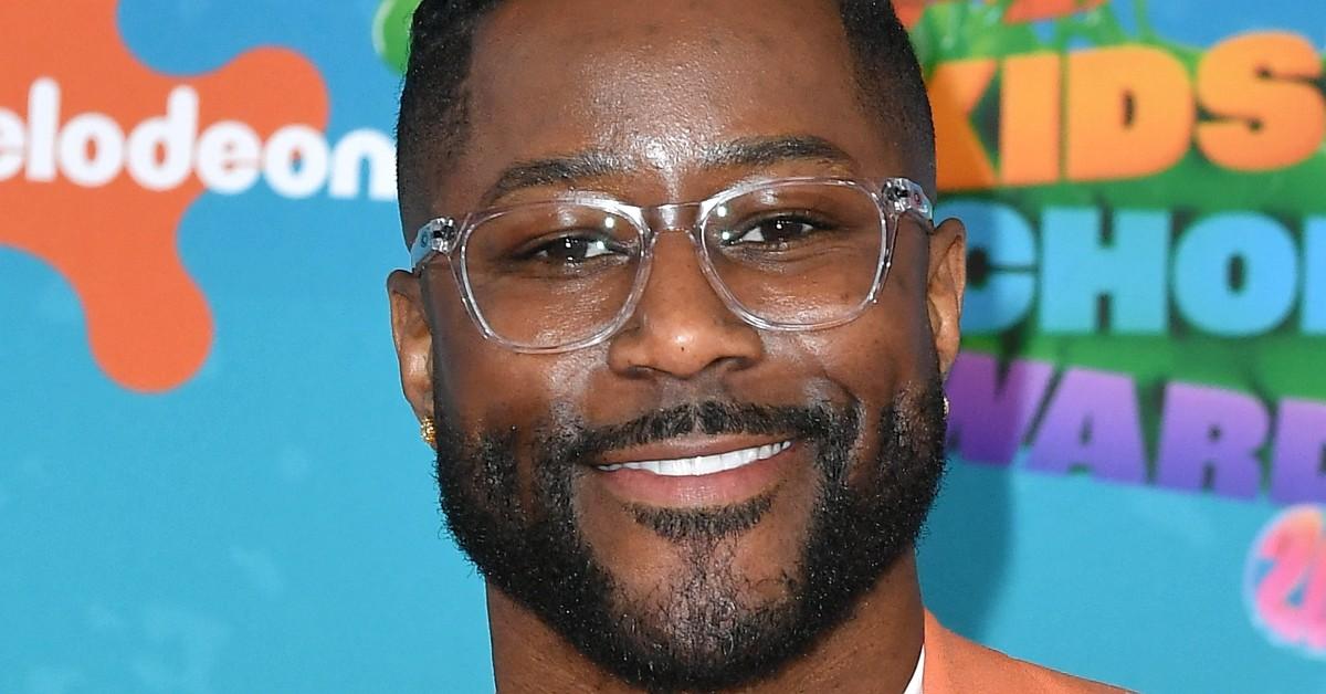 Nate Burleson posing for a press photo at Nick's Award Ceremony