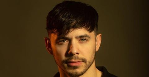 David Archuleta standing in front of a brown backdrop