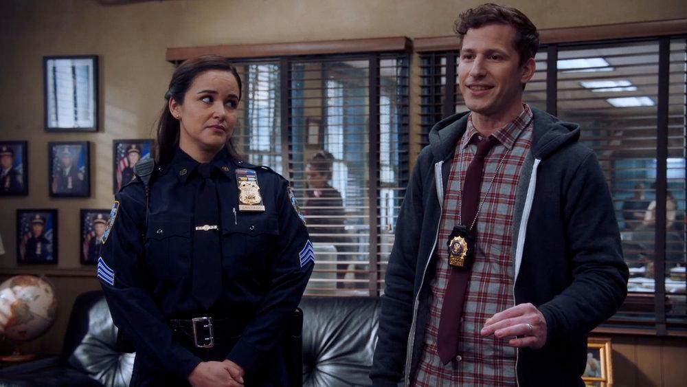 Melissa Fumero as Amy Santiago, Andy Samberg as Jake Peralta 