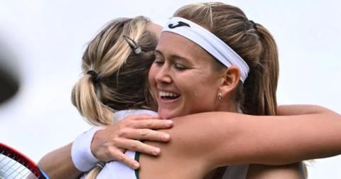Anett Kontaveit hugging an oponent during her final match at 2023 Wimbledon in London.