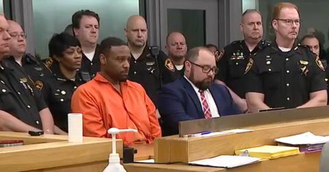 Rodney Hinton in court, surrounded by police