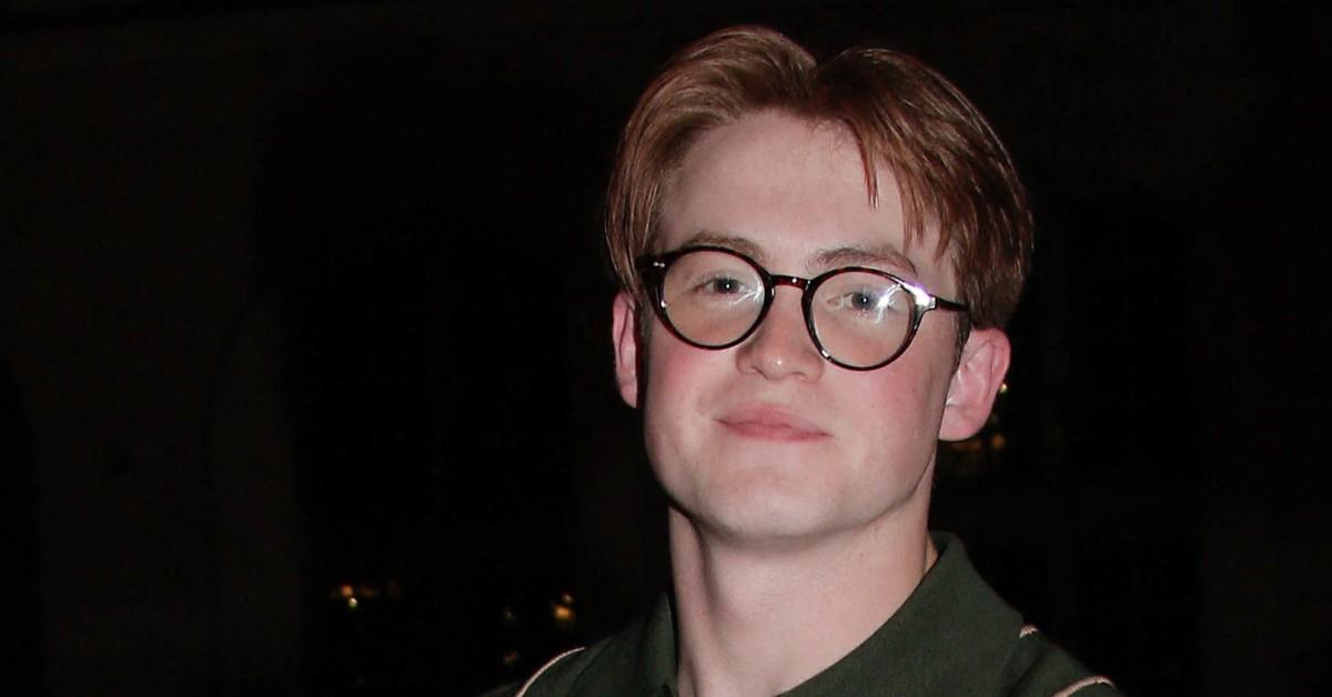 Kit Connor wearing glasses at a party