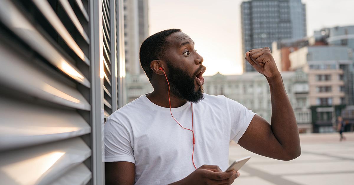 Man celebrating a successful sports bet 