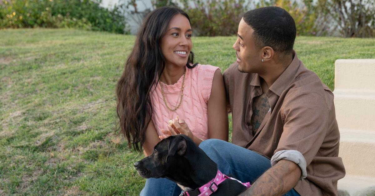 Litia and Grant with a dog on their date on the bachelor