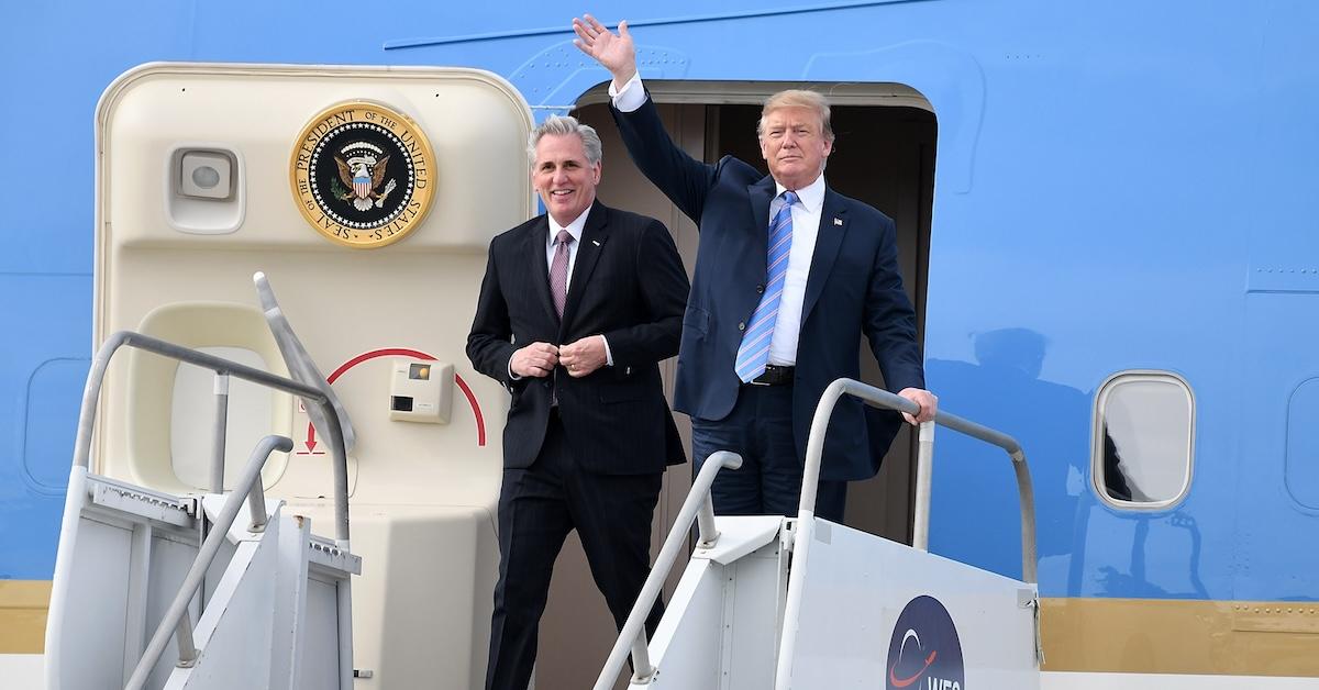Kevin McCarthy and Donald Trump standing at the top of the stairs on Air Force One