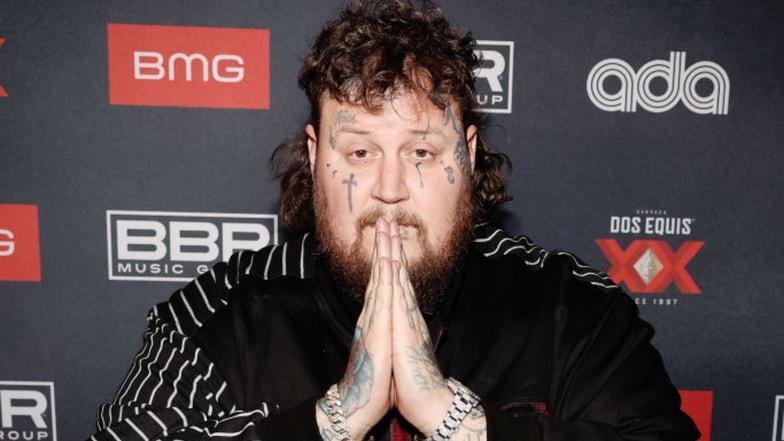 Jelly Roll demonstrated "praying hands" on red carpet.