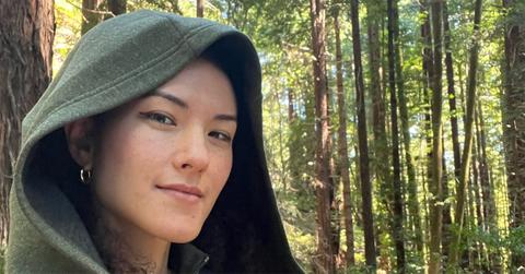 Jay Graber in a hood in the woods.