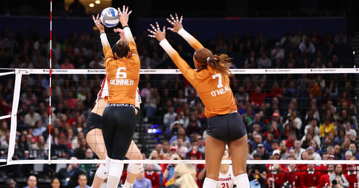 Madisen Skinner and Asjia O'Neal of the Texas Longhorns volleyball team wear tape on their fingers. 