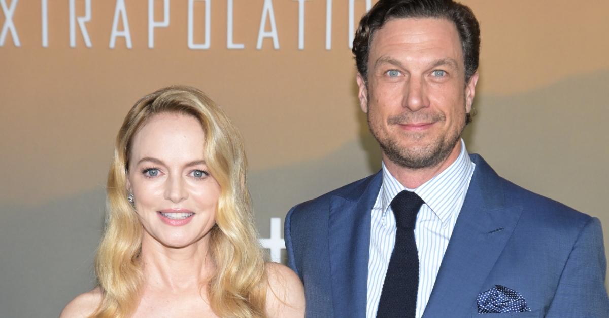 Heather Graham and John de Neufville in 2023 on red carpet for premiere of Extrapolations