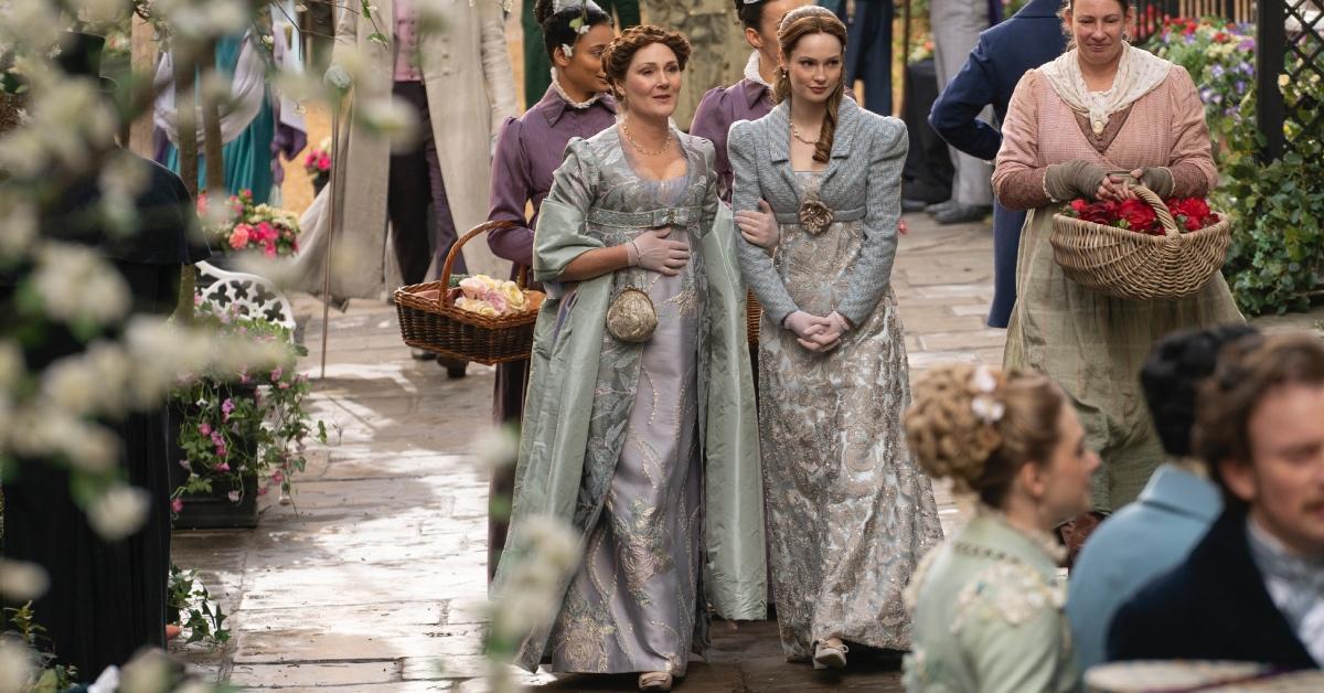 Francesca Bridgerton and her mother Violet walking through the market.