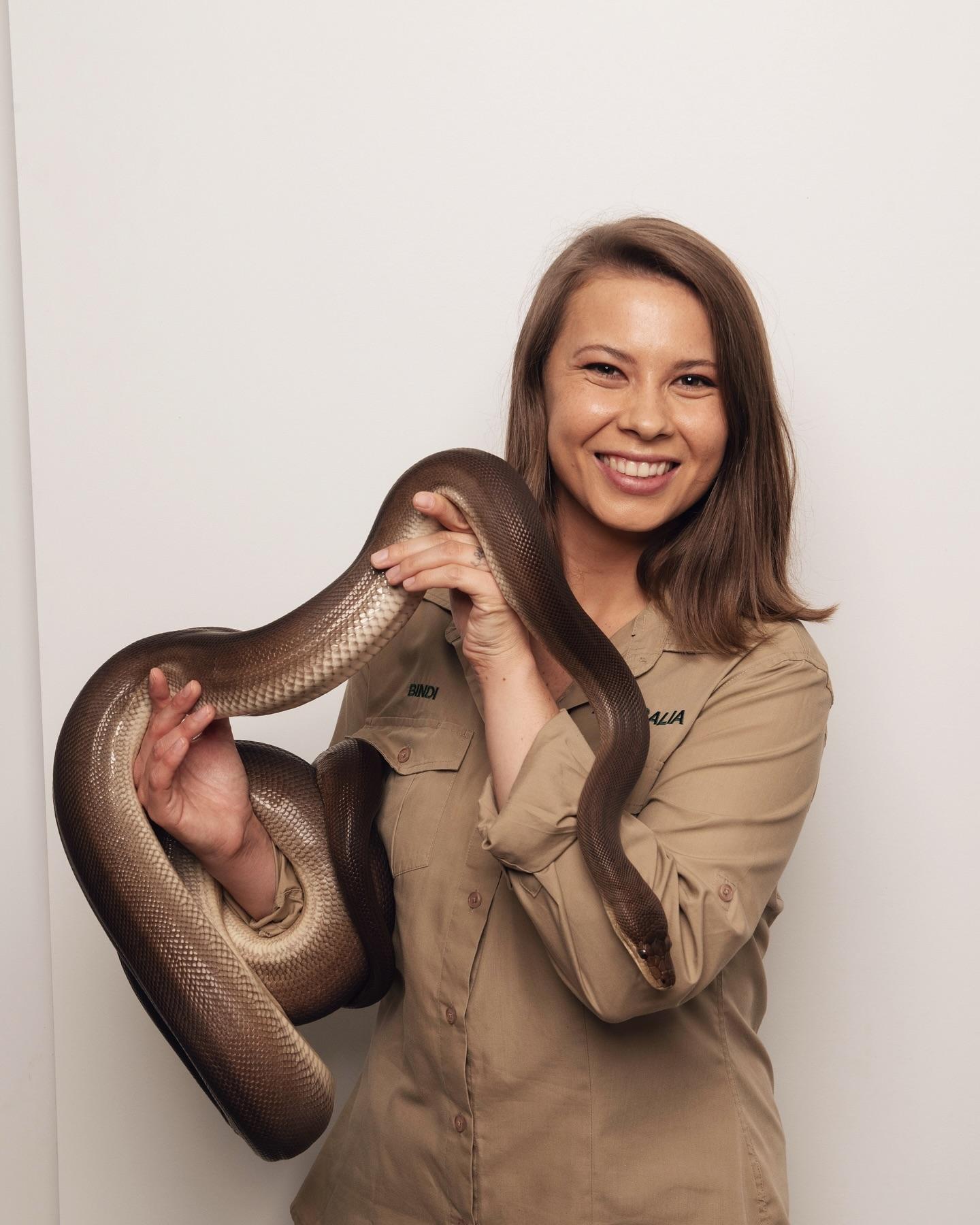 Bindi Irwin holding a snake 