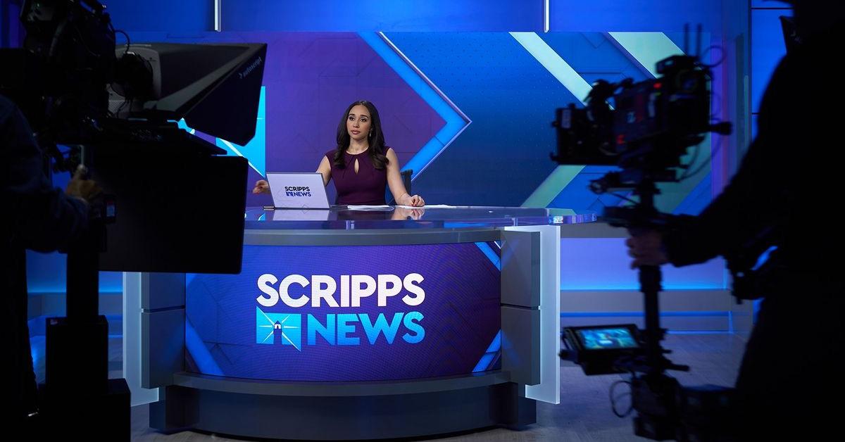 An anchor sitting behind a desk on Scripps News. 