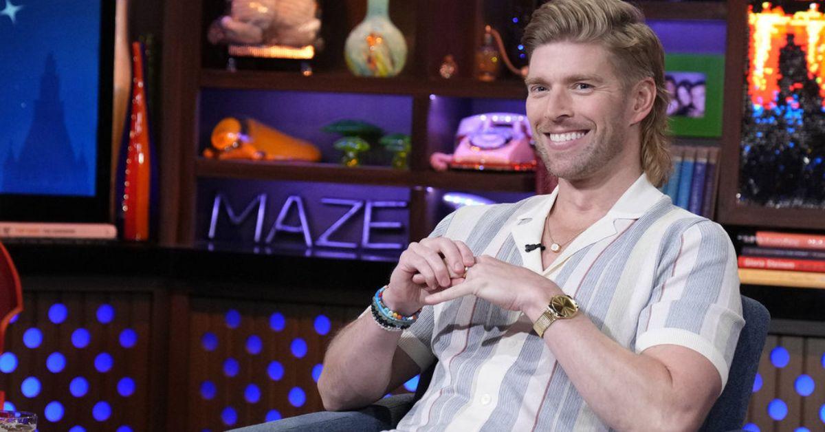 Kyle Cooke sits smiling on 'WWHL'