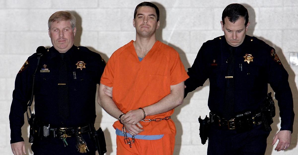 Convicted murderer Scott Peterson is escorted by two San Mateo County Sheriff deputies as he is walked from the jail to an awaiting van March 17, 2005 in Redwood City, California. Scott Peterson was transported to San Quentin Prison death row after he was formally sentenced to death for the murder or his wife Laci and their unborn son. (Photo by Justin Sullivan/Getty Images)