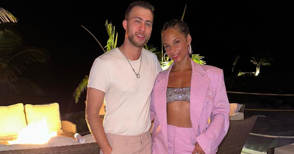 Cole Cook and his sister, Alicia Keys, outside on a patio at night