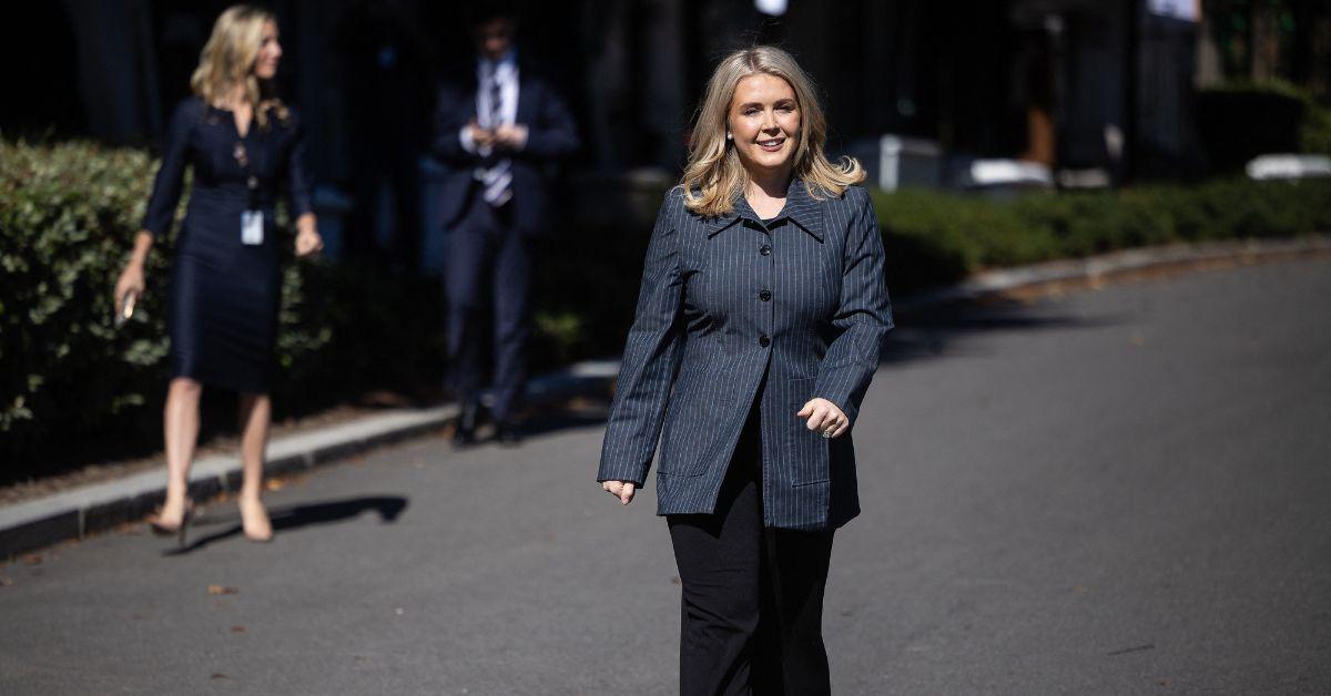 Karoline Leavitt walking up to reporters. 