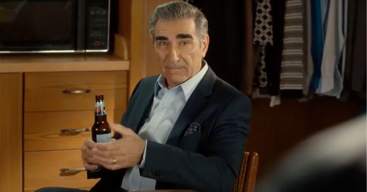 Johnny Rose in his motel room on 'Schitt's Creek'