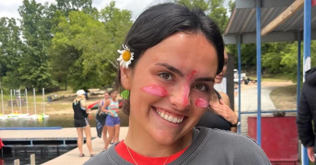 Samantha Fulnecky by the water wearing face paint.