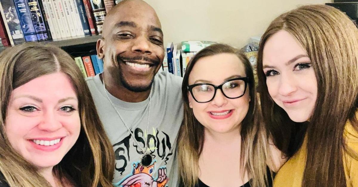 The Davis family from Seeking Sister Wife in front of a bookshelf