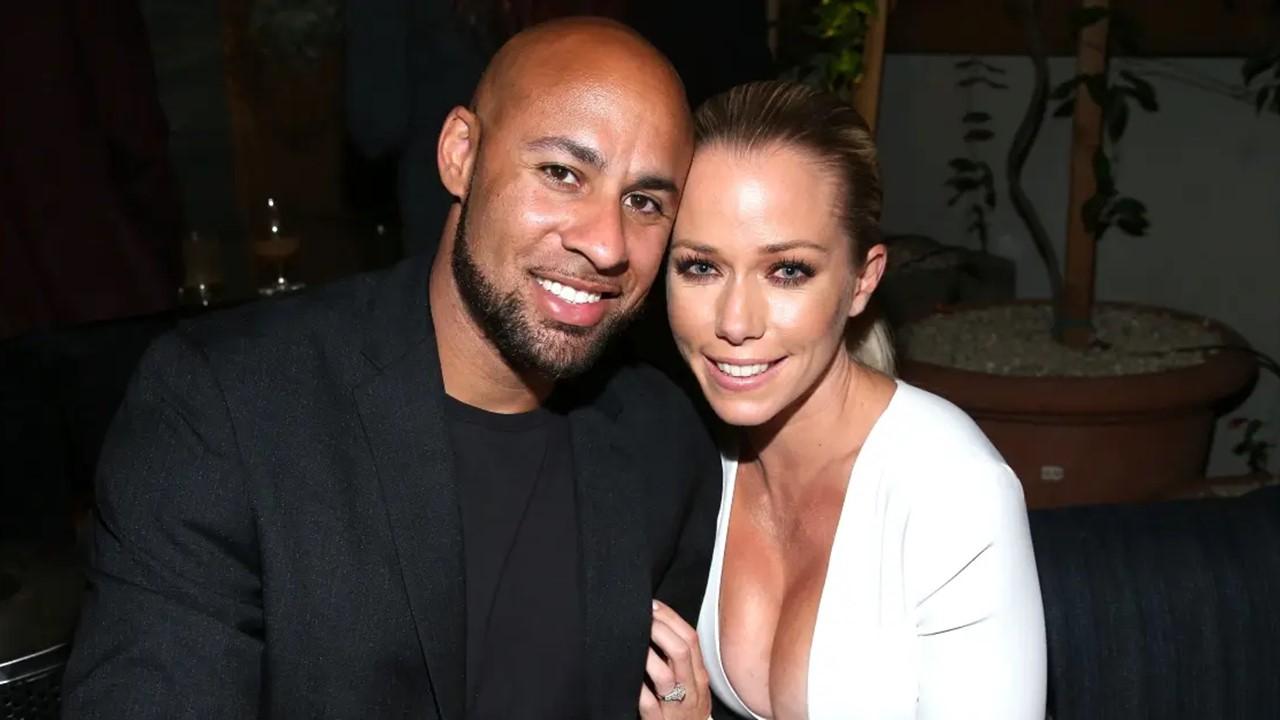 Hank Baskett and Kendra Wilkinson smiling at WE tv's premiere of "Kendra On Top" and "Driven To Love" on March 31, 2016