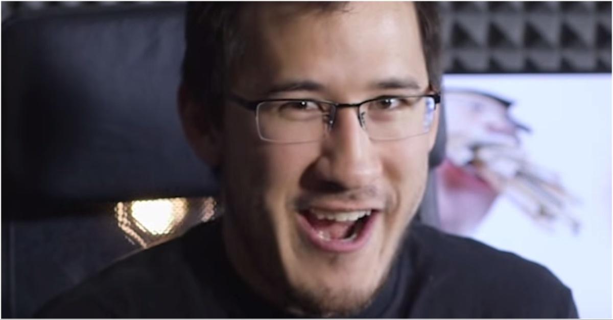 Markiplier smiling big in a gaming chair