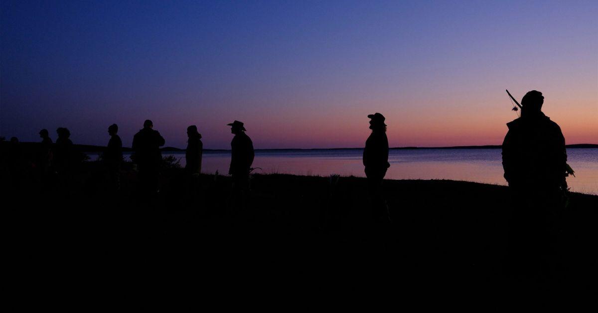 'Alone' Season 10 participants line up against the backdrop of a sunset
