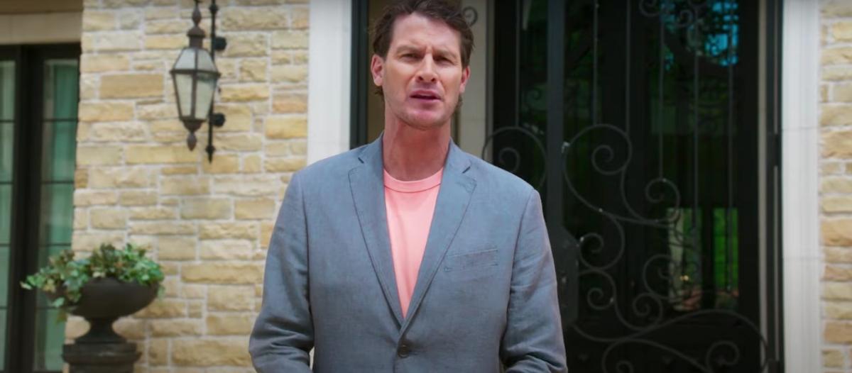 Daniel Tosh in front of the front door of The Goat mansion