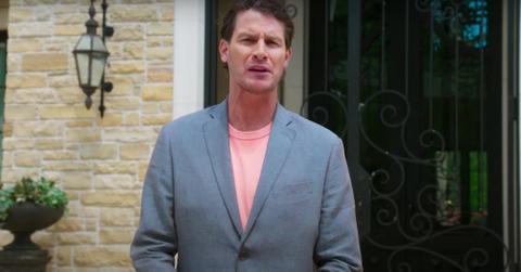 Daniel Tosh in front of the front door of The Goat mansion