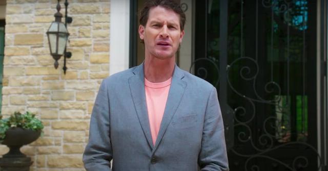 Daniel Tosh in front of the front door of The Goat mansion