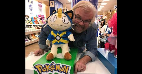 James Carter Cathcart in front of a Meowth doll