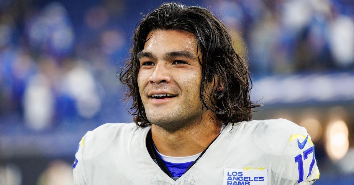 Puka Nacua smiles in Los Angeles Rams uniform