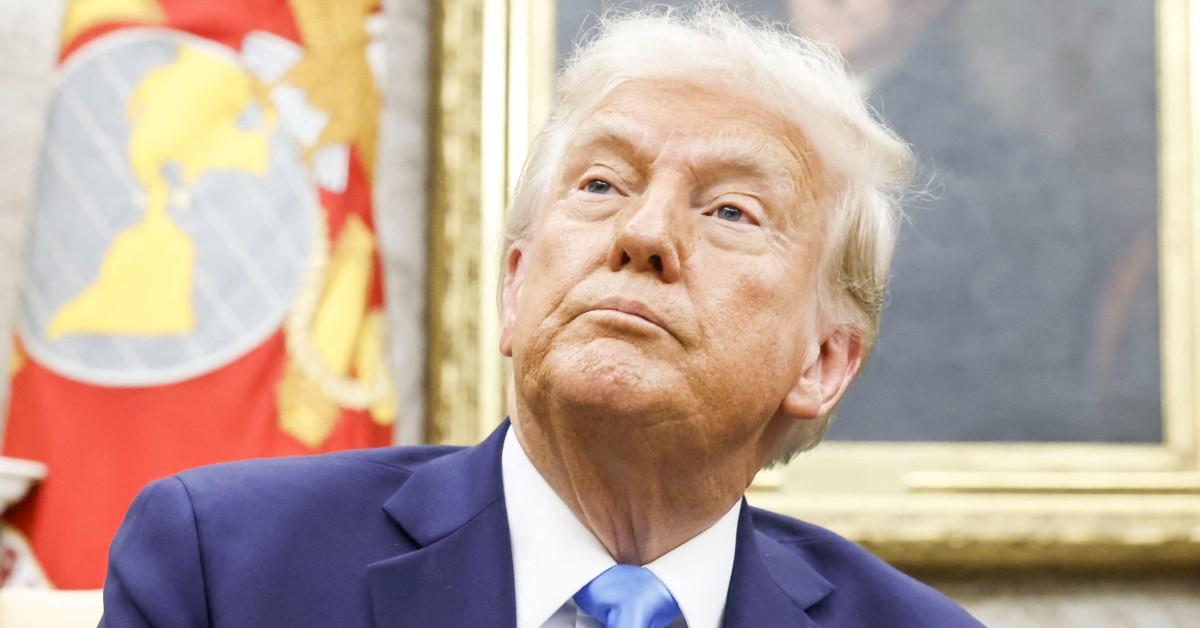 Donald Trump looking up with a sad face