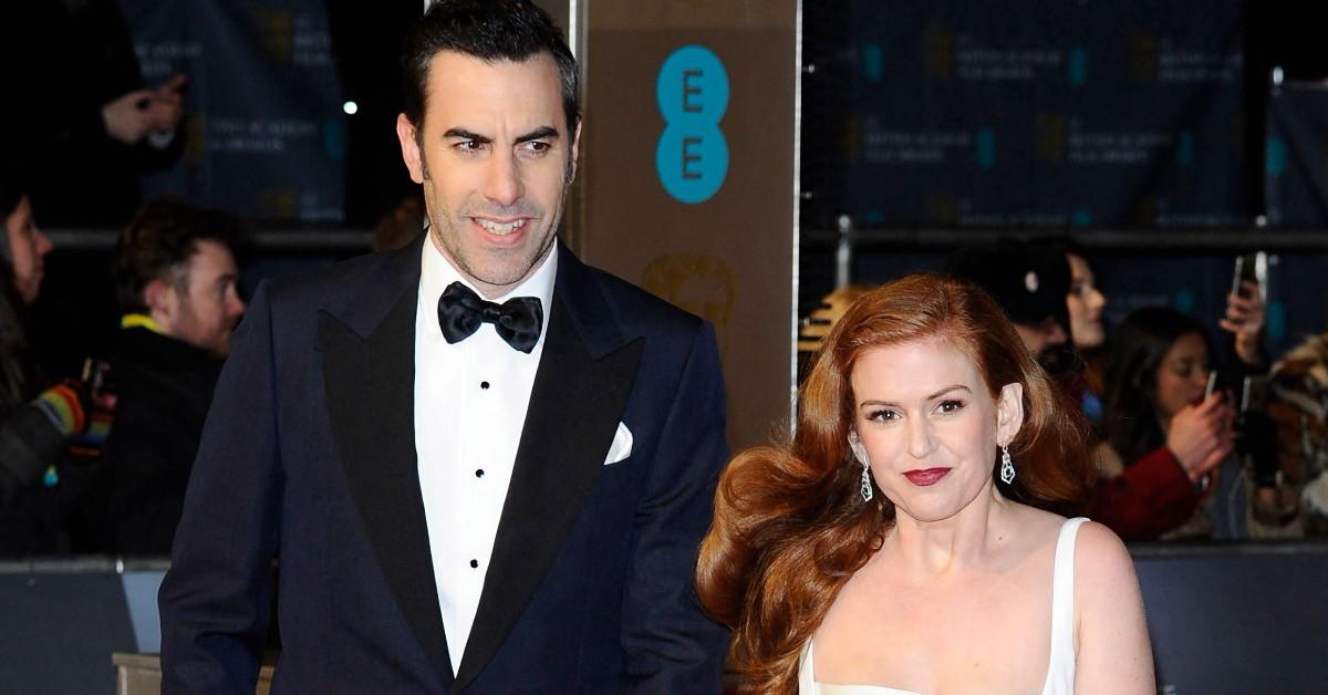 Sacha Baron Cohen and Isla Fisher posing for a couple's press photo