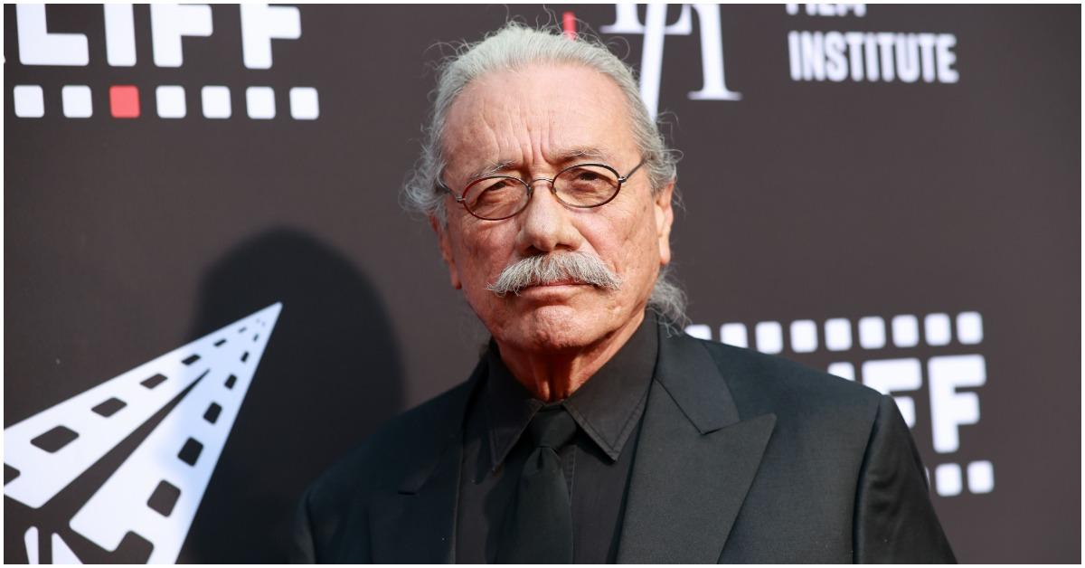 Edward James Olmos looking straight ahead and smiling at a premiere.