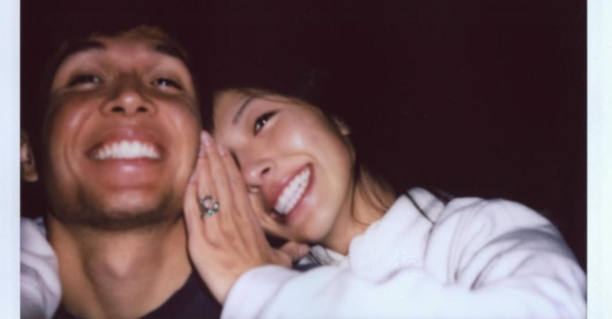 Alex Albon and Lily Muni He smile and cuddle as Lily shows off her new engagement ring.