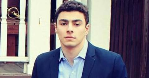 Luigi Mangione wearing a blazer and buttoned up shirt