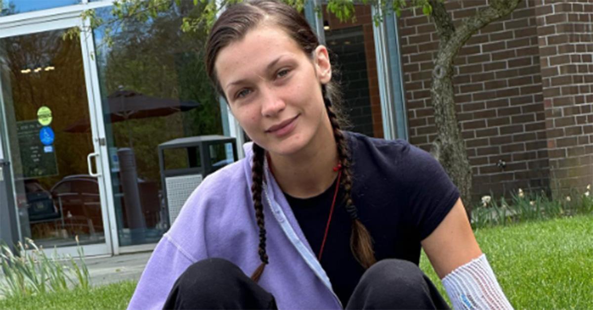 Bella Hadid sitting in braids outside a hospital. 