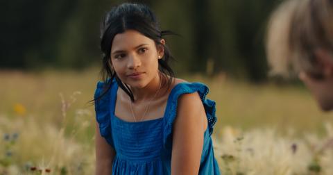 Jackie and Cole sitting in a flower field in 'My Life With the Walter Boys'