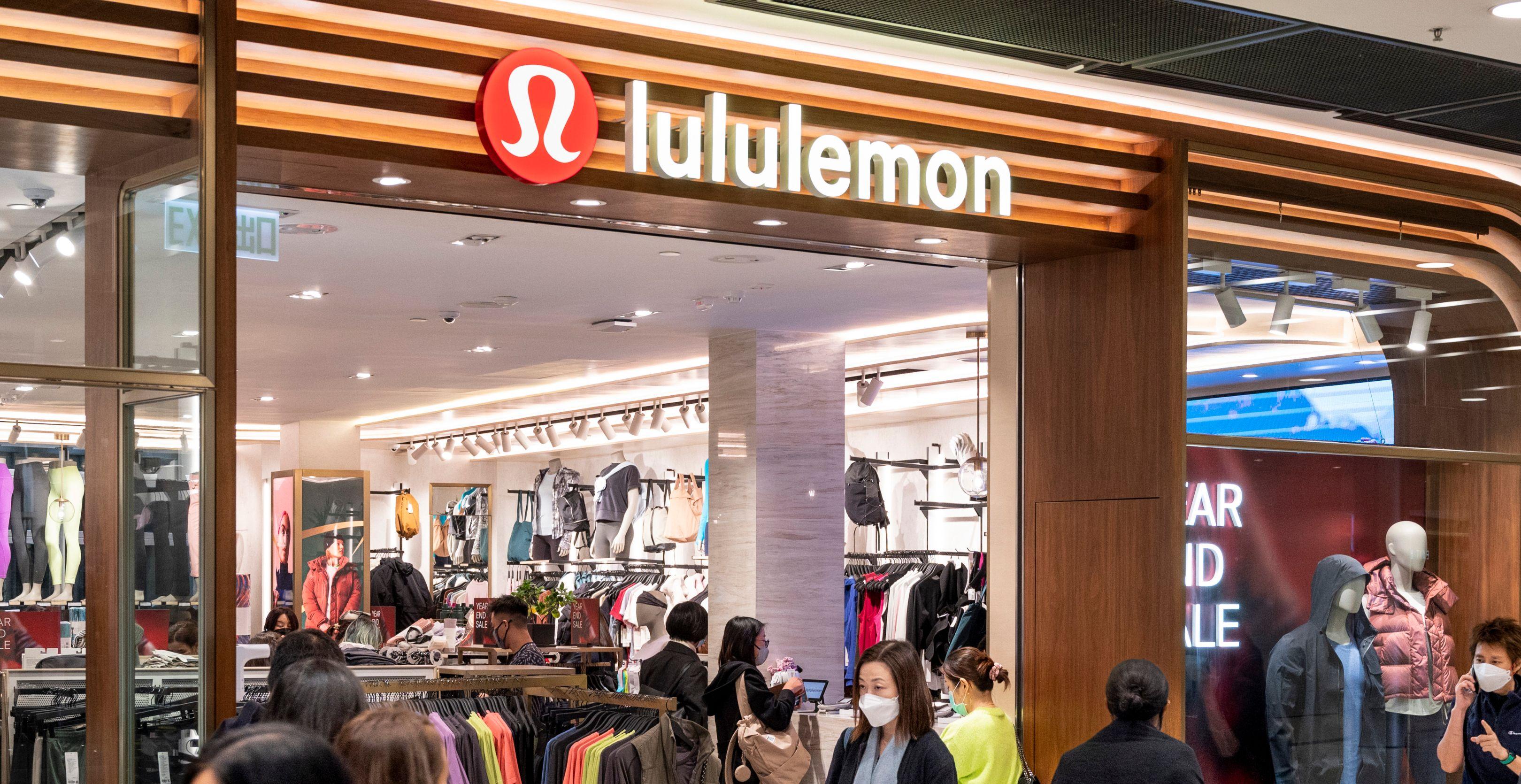  Shoppers walk past the Canadian sportswear clothing band, Lululemon store in Hong Kong.