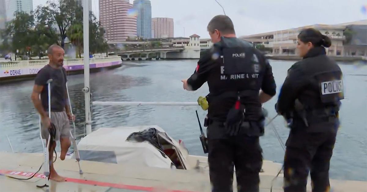 Joseph Malinowski spekaing with police outside of his boat. 