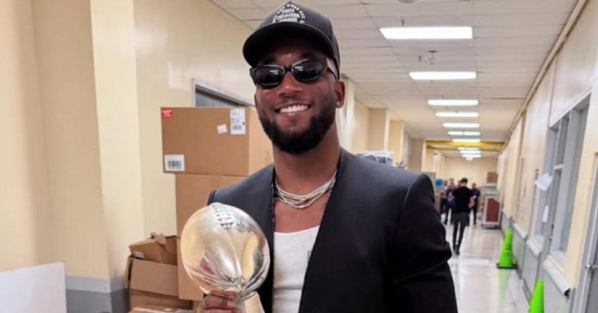 James Bradberry smiling and posing with the Eagles Super Bowl LIX trophy.