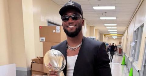 James Bradberry smiling and posing with the Eagles Super Bowl LIX trophy.